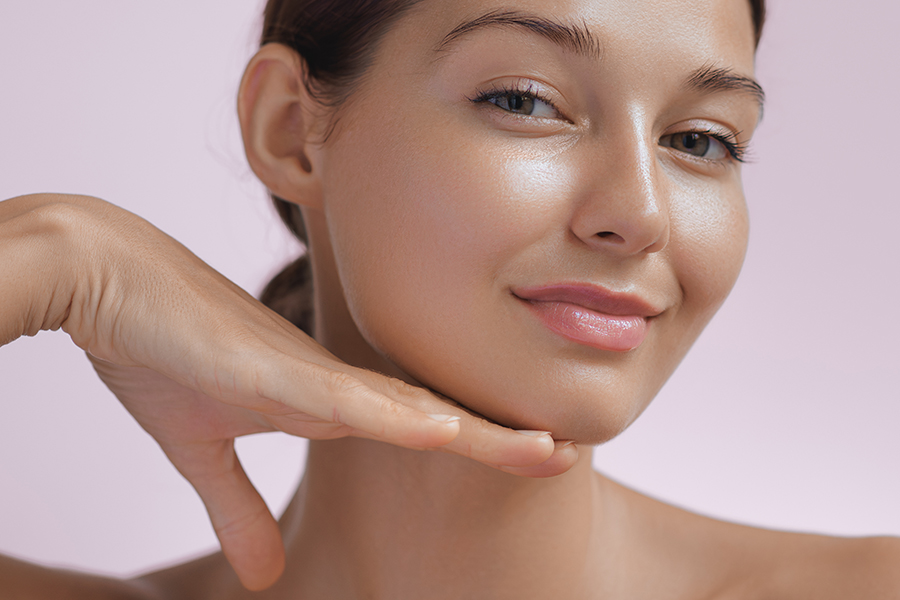 Beauty Photo Of Woman With Clean And Healthy Skin Touching Her Face