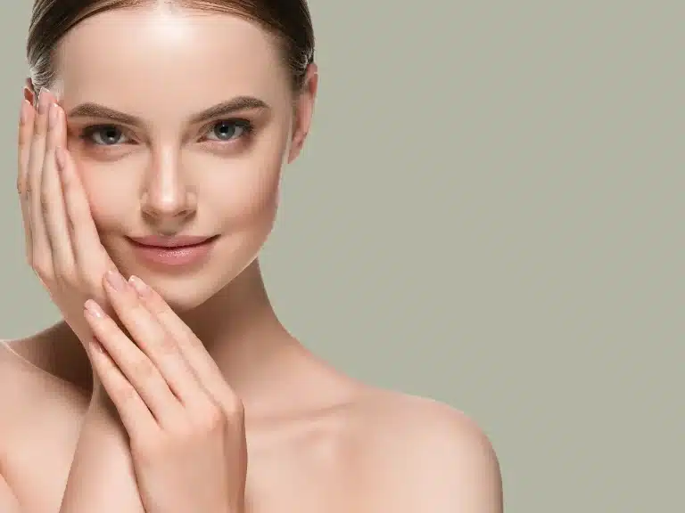 A close up portrait of a young woman with flawless smooth skin